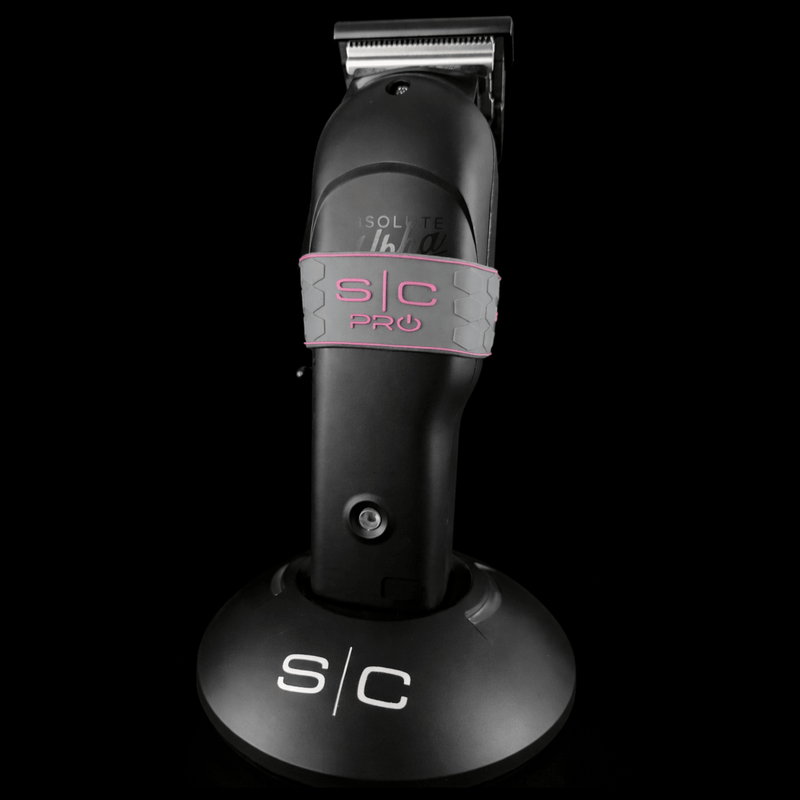 Hair trimmer with 's/c' grey and pink grip on a black background