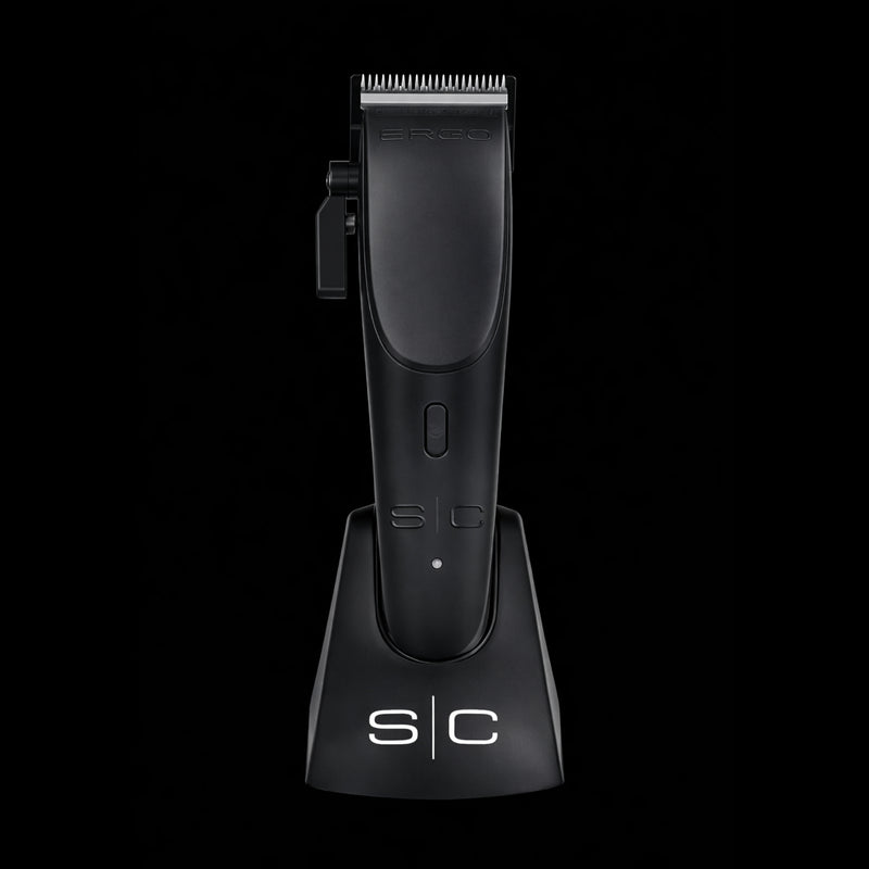 StyleCraft Ergo clipper placed vertically in its professional anti-slip charging dock for workstation organization.