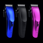 Side profile of the StyleCraft Ergo professional clipper highlighting the ergonomic thumb rest and sleek modular housing.