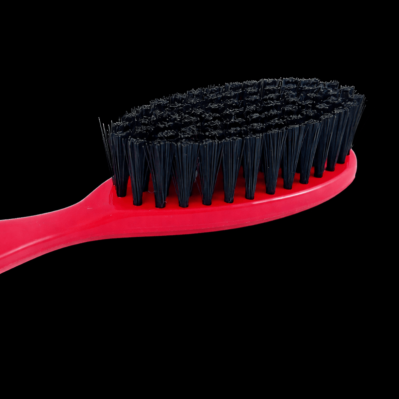 Red brush with black bristles on a transparent background