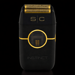 Black and gold electric shaver with 'SC' branding on a black background