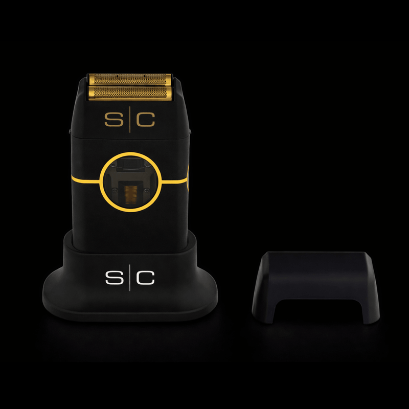 Black and gold electric shaver with 's/c' branding on a black background
