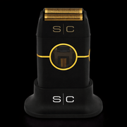 Black and gold electric shaver with 's/c' branding on a black background