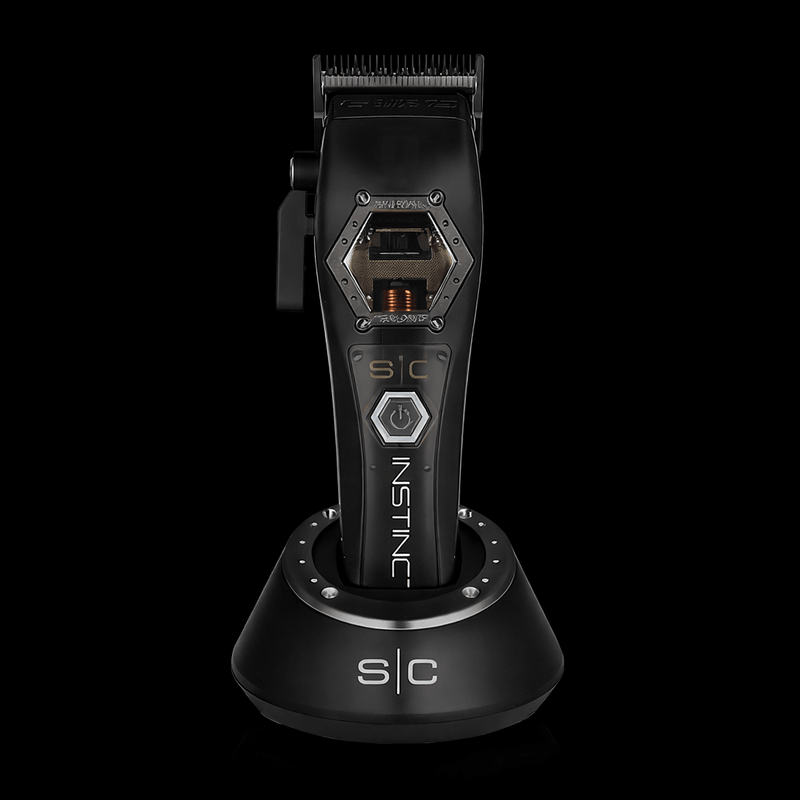 StyleCraft Instinct Metal Edition cordless hair clipper with IN2 Vector motor on charging stand