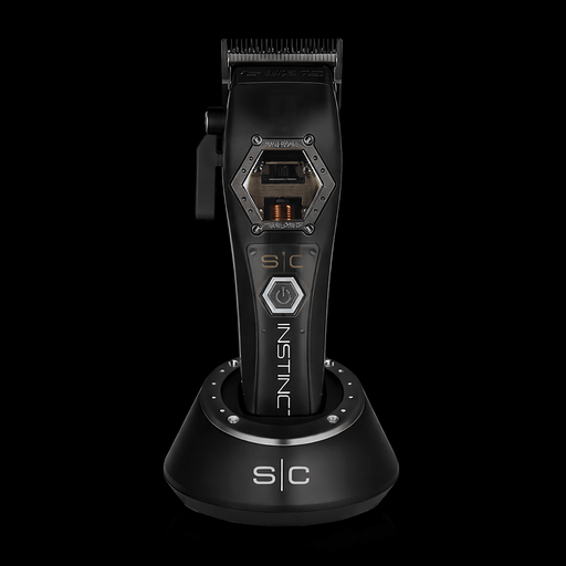 StyleCraft Instinct Metal Edition cordless hair clipper with IN2 Vector motor on charging stand