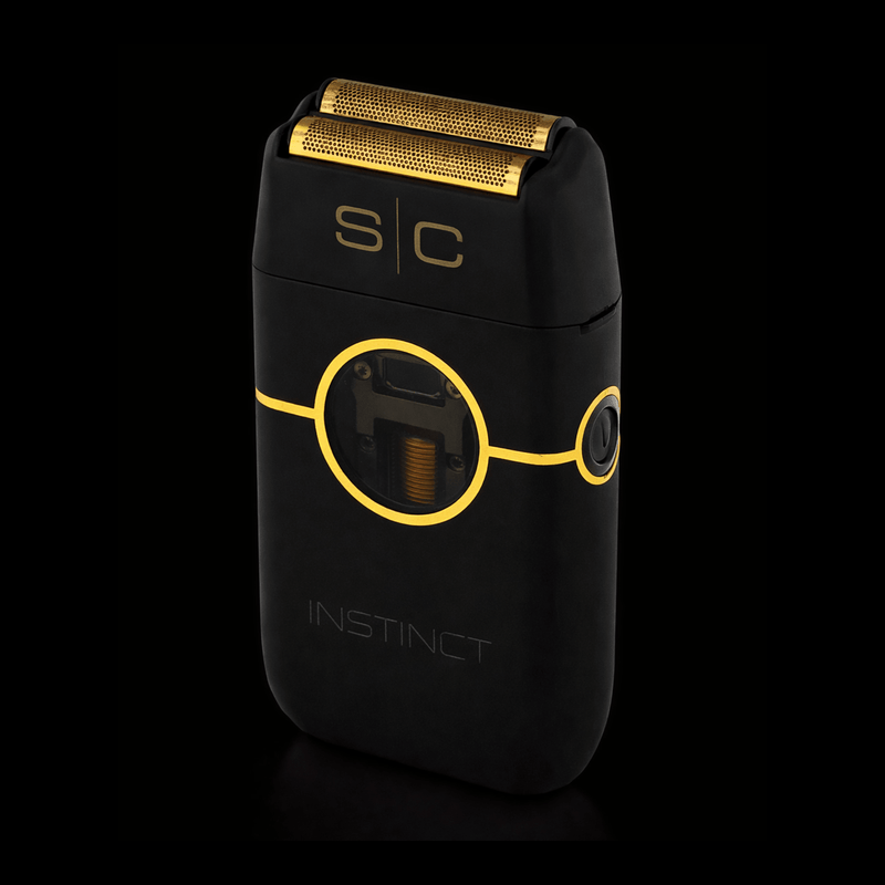 Black and gold electric shaver with 'SC' branding on a black background