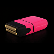 Pink and black metal edition lighter on a black background