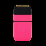 Pink and black electric shaver on a black background