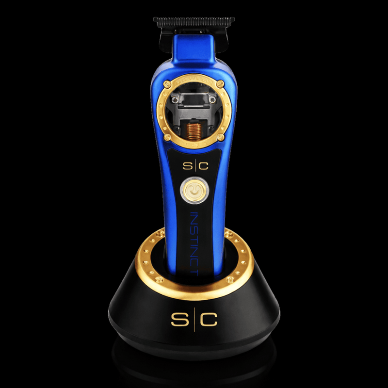 Blue and gold hair trimmer on a black stand with 's/c' branding.