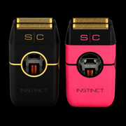 StyleCraft Instinct foil shavers in black and pink with gold titanium foils on a black background