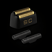 Shaver head with gold foil and black housing on a black background