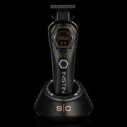 Black grooming tool with 'Instin' branding on a black background