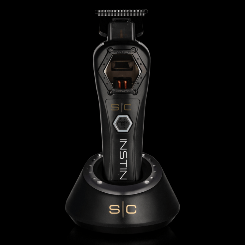 Black grooming tool with 'Instin' branding on a black background