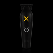 Black grooming tool with 'Instinct X' branding on a black background