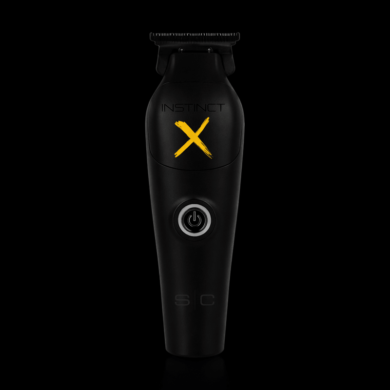 Black grooming tool with 'Instinct X' branding on a black background