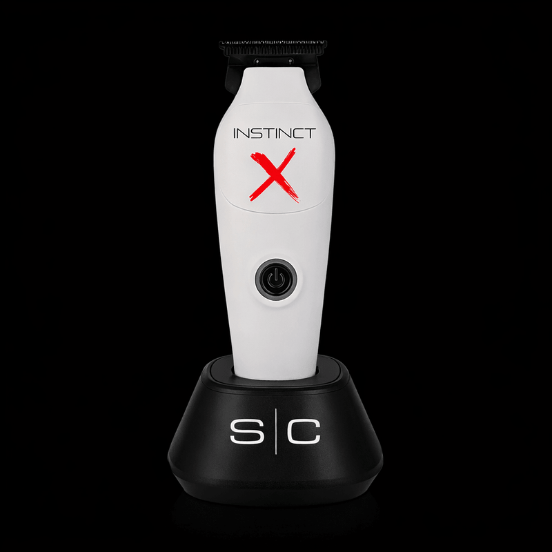 White grooming tool with red 'X' and 'SC' branding on a black background