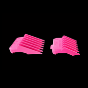 Two pink hair clipper attachments on a black background