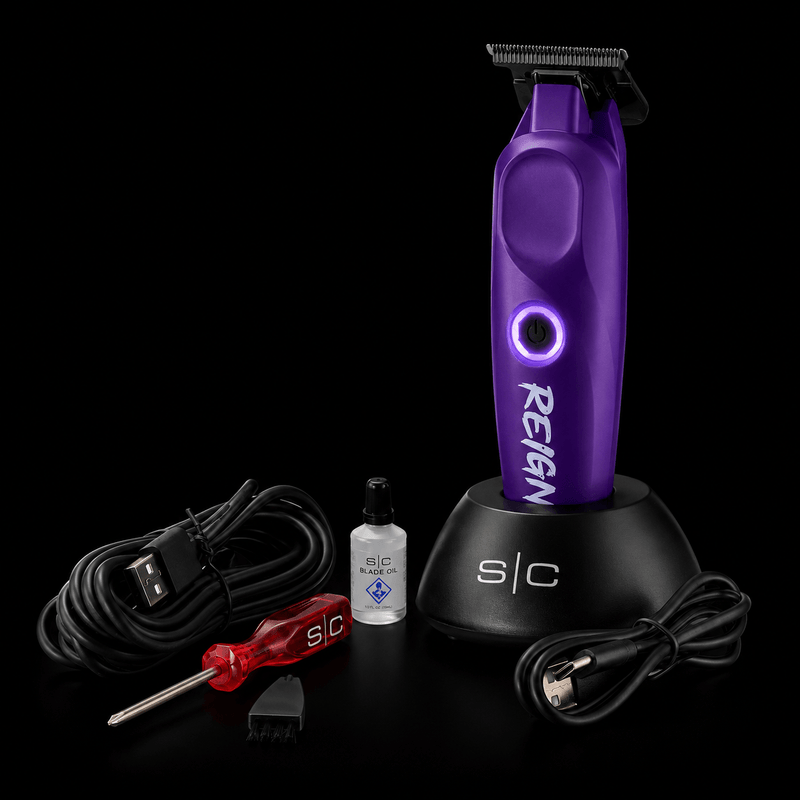 StyleCraft Purple Reign trimmer kit with charging stand, USB cable, blade oil, screwdriver, and cleaning brush.