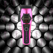 Pink and black grooming tool with 'Instinct' branding on a patterned background