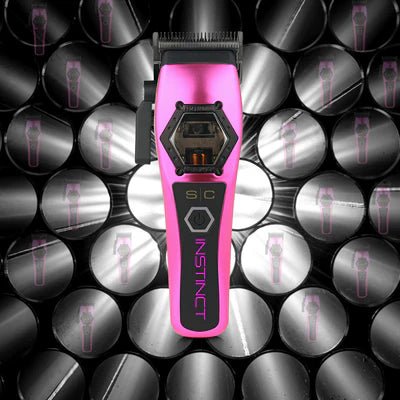 Pink and black grooming tool with 'Instinct' branding on a patterned background