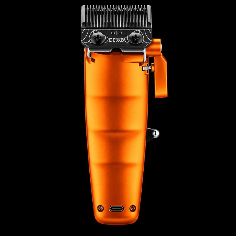 StyleCraft Saber 2.0 orange clipper back view with DLC Echo blade, ribbed grip and USB-C charging port