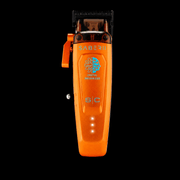 StyleCraft Saber 2.0 cordless professional clipper in metallic orange with digital brushless motor and LED battery indicator, front view on black background