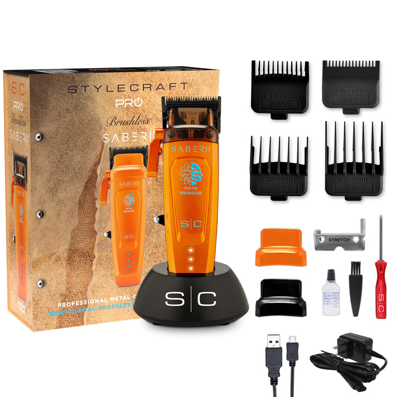StyleCraft Saber 2.0 orange clipper kit contents: box, charging stand, 4 guards, oil, brush, USB-C cable and adapter