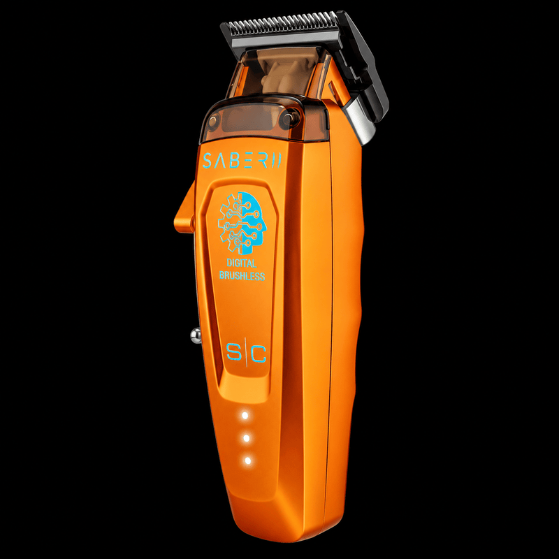 StyleCraft Saber 2.0 orange clipper angled right view with translucent top housing and Saber II logo on black background