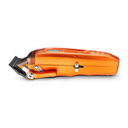 StyleCraft Saber 2.0 orange clipper side profile lying flat with taper lever and blade