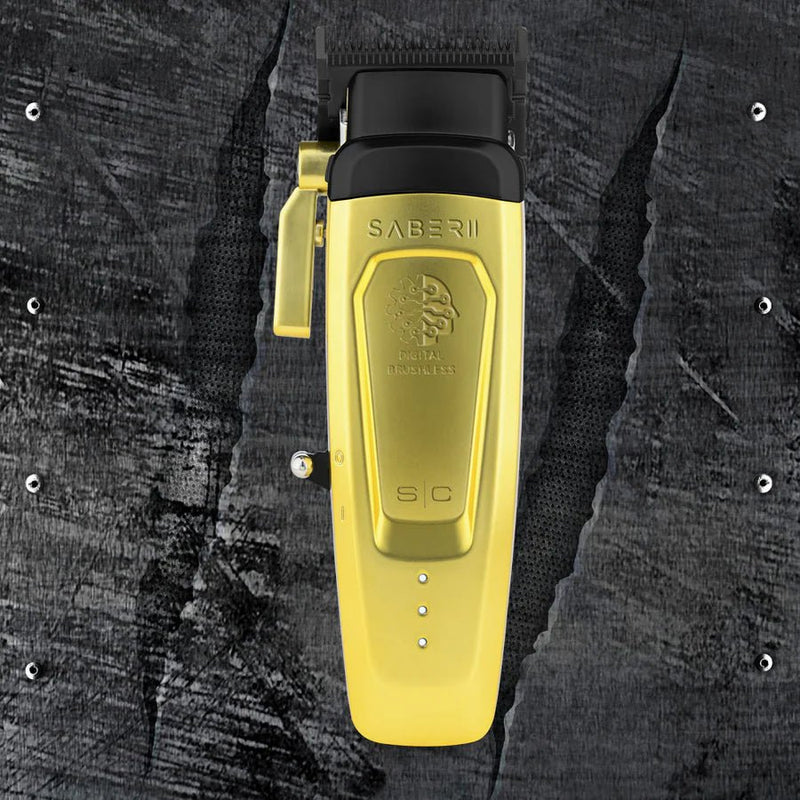 Yellow grooming clipper with Saberii branding on a textured black background