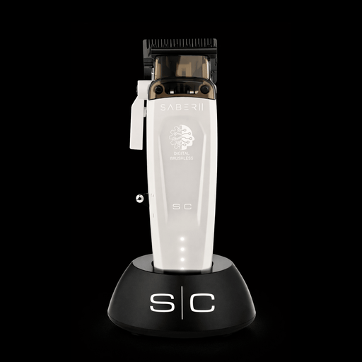Hair trimmer with a clear body and black top on a black background