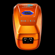 StyleCraft Saber orange trimmer base view showing charging stand contacts, power button and S|C logo