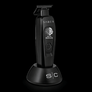 Black grooming tool with 'Saber' branding on a black background