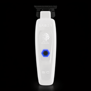 White grooming tool with 'Saber' branding on a black background