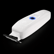White grooming tool with brand name on a black background