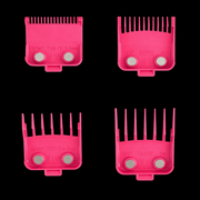 Four pink hair clipper comb attachments on a black background