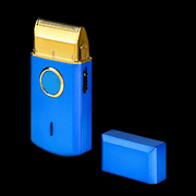 Blue electric shaver with gold top on a black background