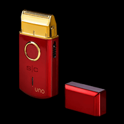 StyleCraft Uno red cordless foil shaver with protective cap removed and gold titanium foil side angle