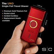StyleCraft Uno red travel foil shaver shown in hand highlighting compact pocket-size design