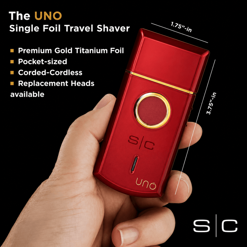 StyleCraft Uno red travel foil shaver shown in hand highlighting compact pocket-size design
