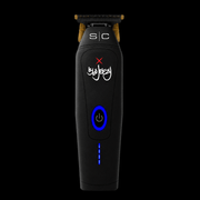 StyleCraft x 360 Jeezy cordless trimmer front view - matte black body with gold T-blade and blue LED power button