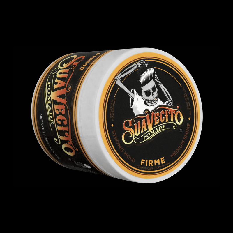 Suavecito pomade jar with skull design on a black background