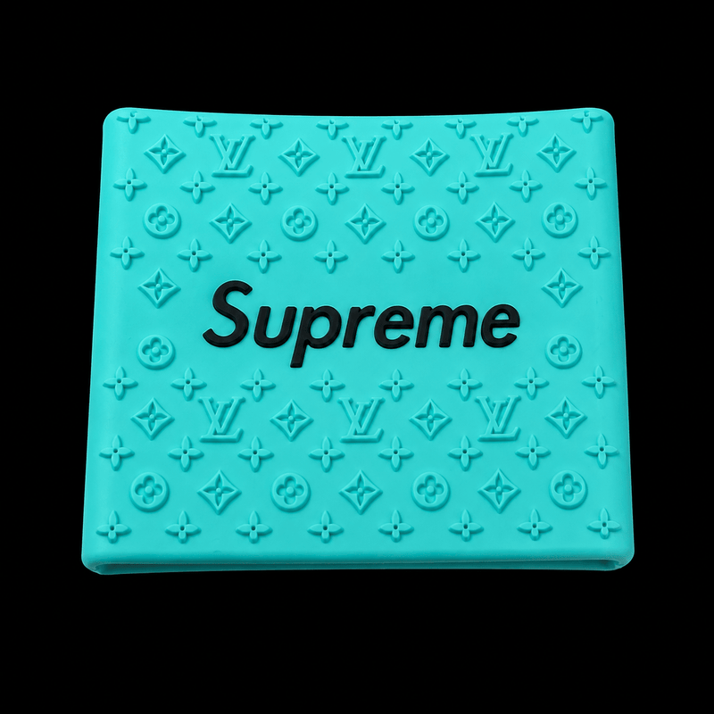 Supreme Clipper Grip in teal with black logo — silicone monogram barber clipper grip
