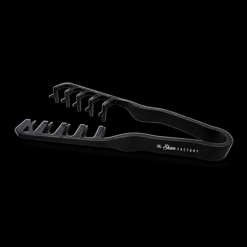 The Shave Factory Hair Texture Tongs in black, side view with open tong arms and Shave Factory logo on a black background