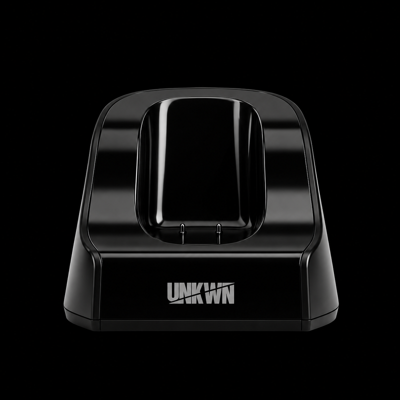 A glossy black charging dock with the brand name 'UNKN' printed in white on the front, set against a solid black background.
