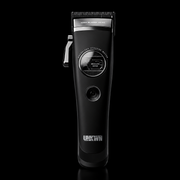 A black electric hair clipper with silver metal blades and a silver power button, shown vertically against a solid black background. The brand name 'UKWIN' is printed in white near the bottom.