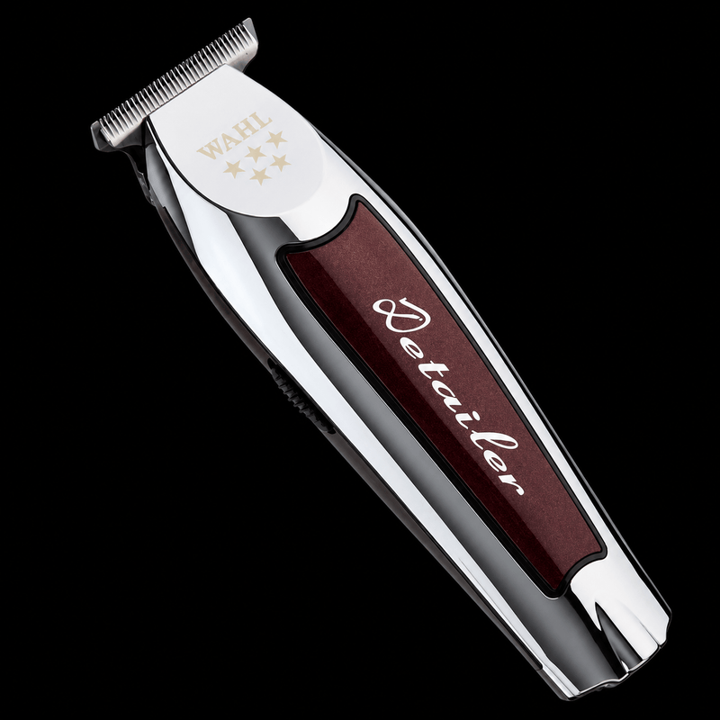 Hair trimmer with a maroon handle and silver top on a black background