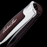 Close-up of a car detailing tool with 'Detailer' branding on a black background
