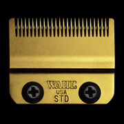 Gold Wahl USASTD hair clipper comb on a black background