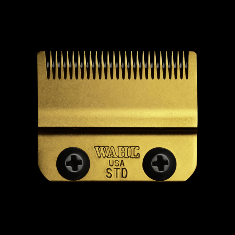 Gold hair clipper comb with 'WAHL USA STD' branding on a black background